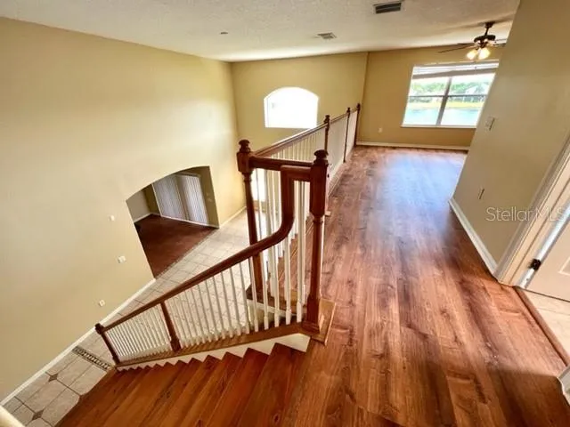 a kitchen with stainless steel appliances granite countertop a refrigerator a stove and a refrigerator