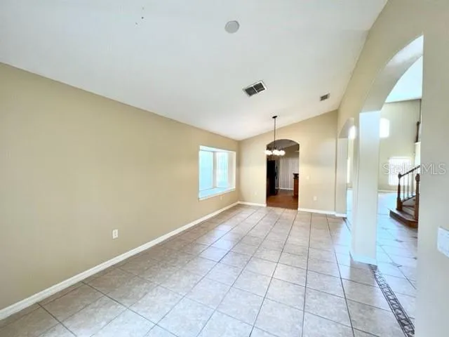 a front view of a house with a garden and porch