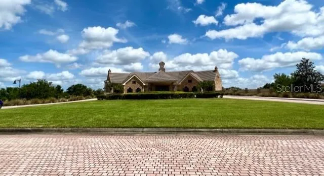 a sign that is on a brick wall