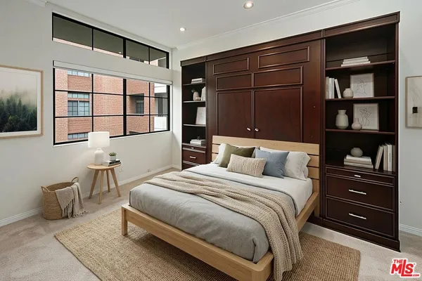 a bedroom with a bed and a cabinets