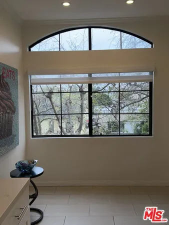 a room with furniture and a flat screen tv