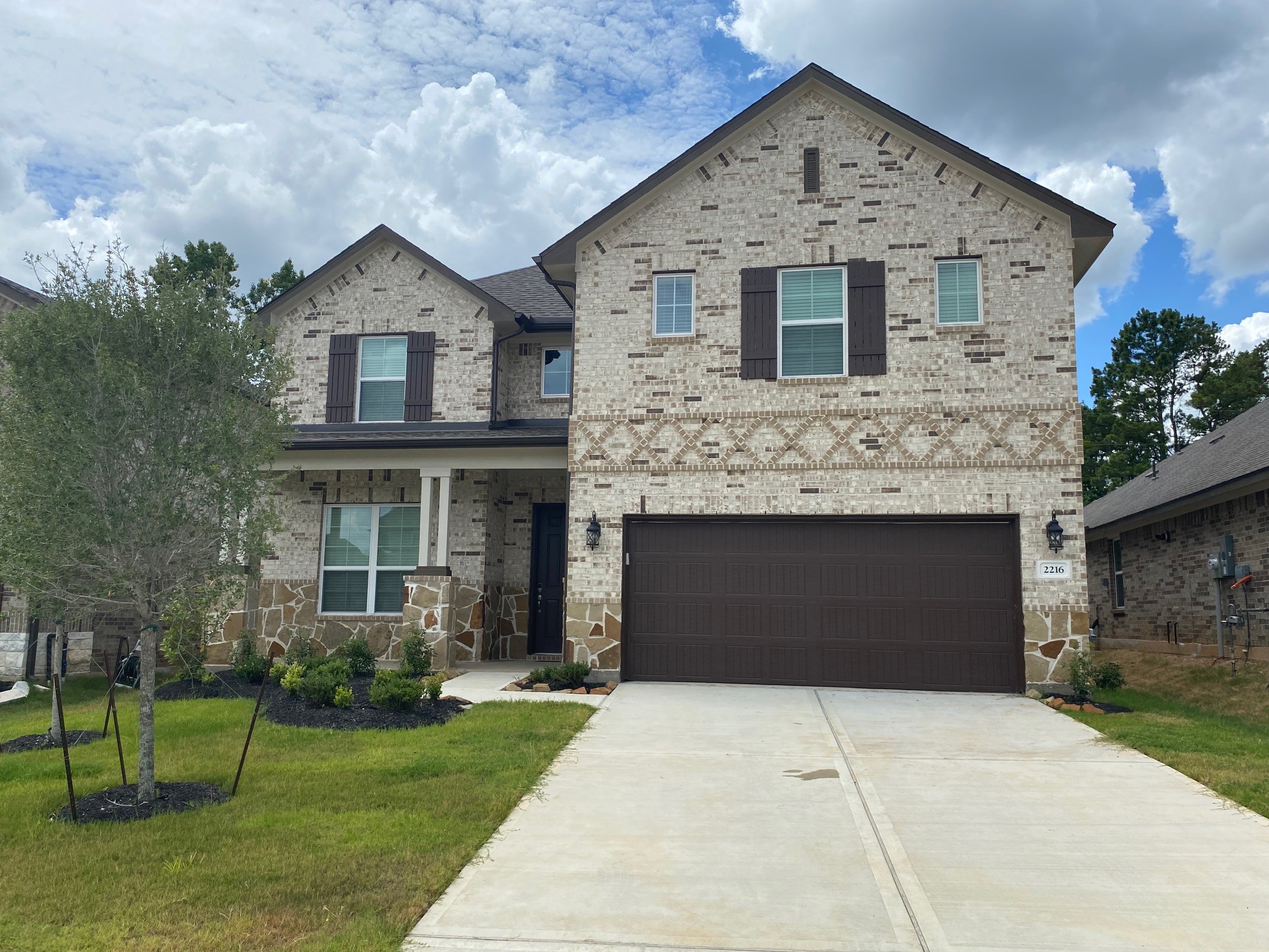 2216 Gadwall Court Conroe, TX 77384 - Photo 1 of 23 a front view of a house with a yard and garage