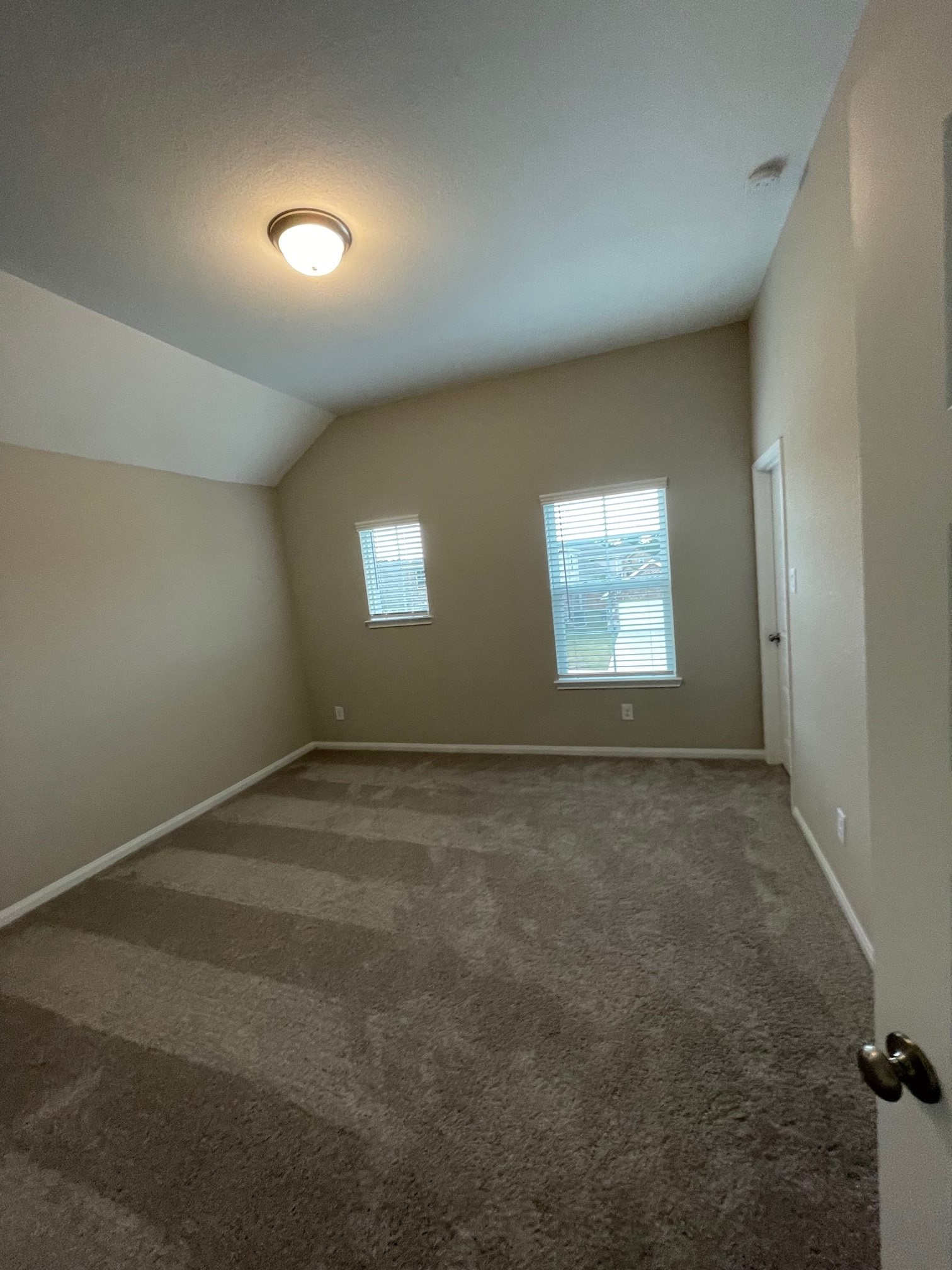 2216 Gadwall Court Conroe, TX 77384 - Photo 16 of 23 an empty room with a empty space and windows