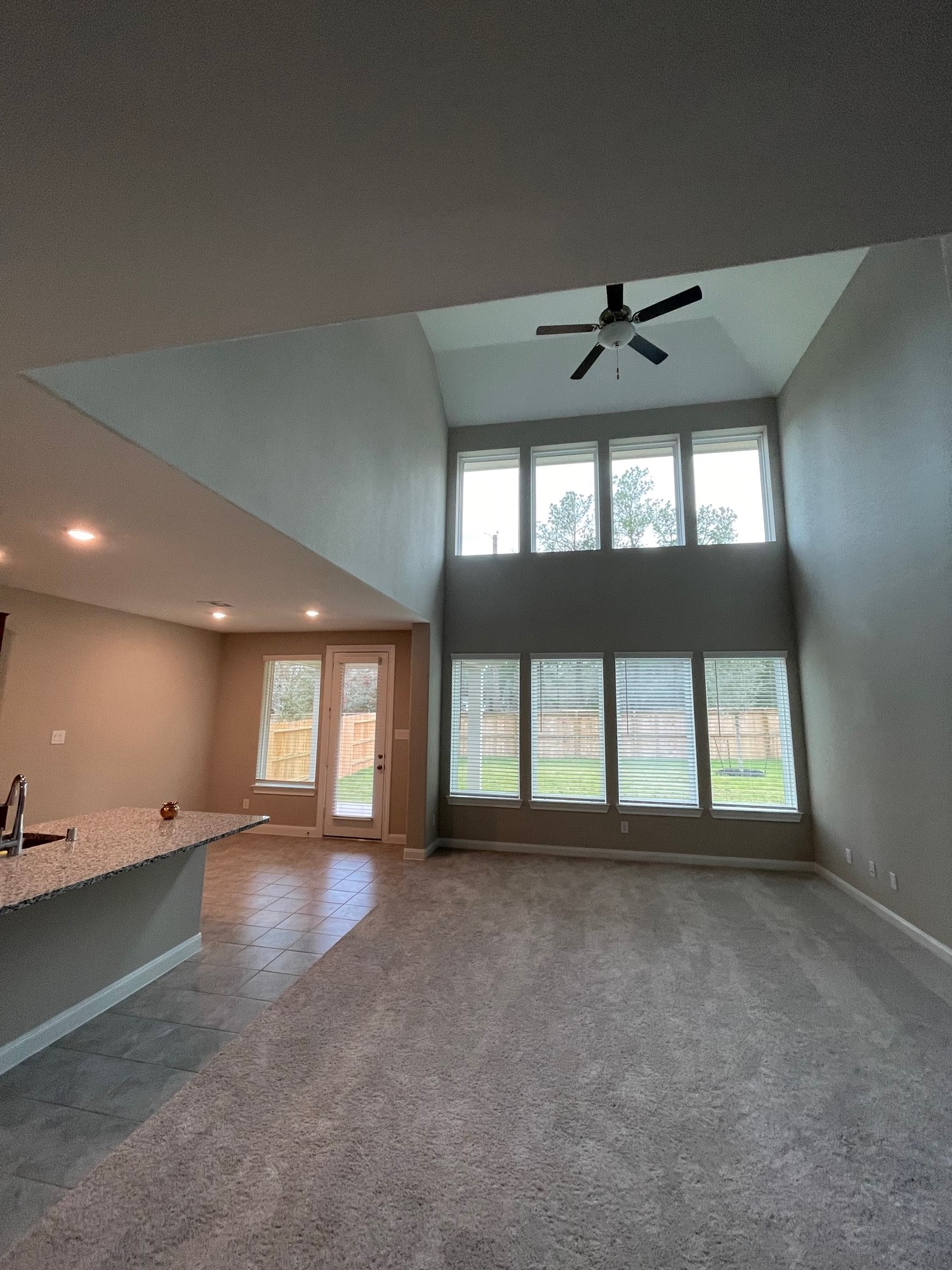 2216 Gadwall Court Conroe, TX 77384 - Photo 19 of 23 an empty room with a empty space and windows