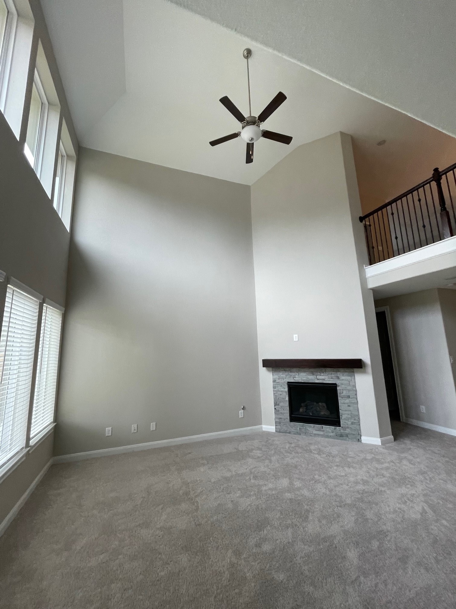 2216 Gadwall Court Conroe, TX 77384 - Photo 4 of 23 a view of an empty room with a fireplace and a window
