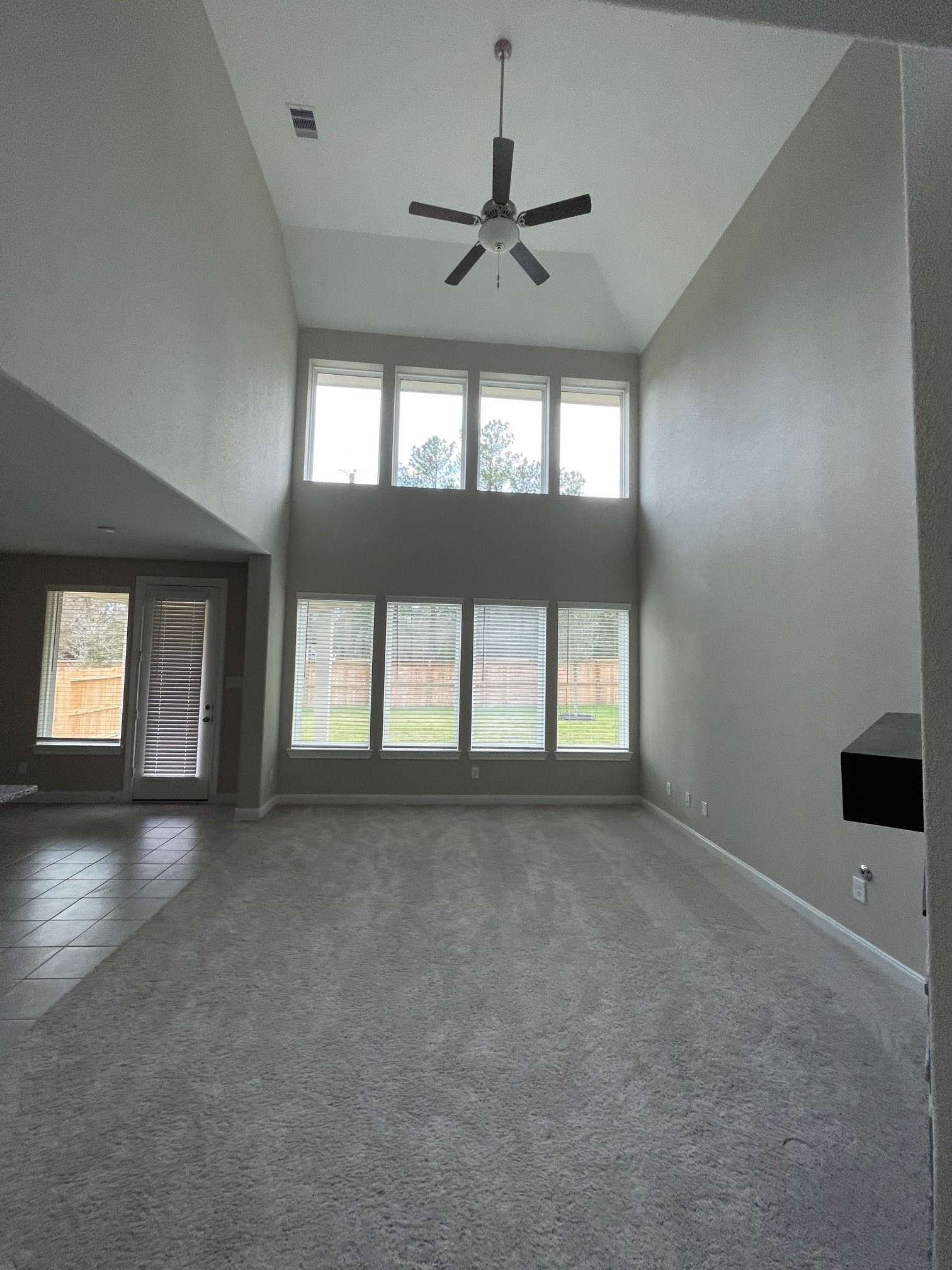 2216 Gadwall Court Conroe, TX 77384 - Photo 5 of 23 an empty room with a empty space and windows