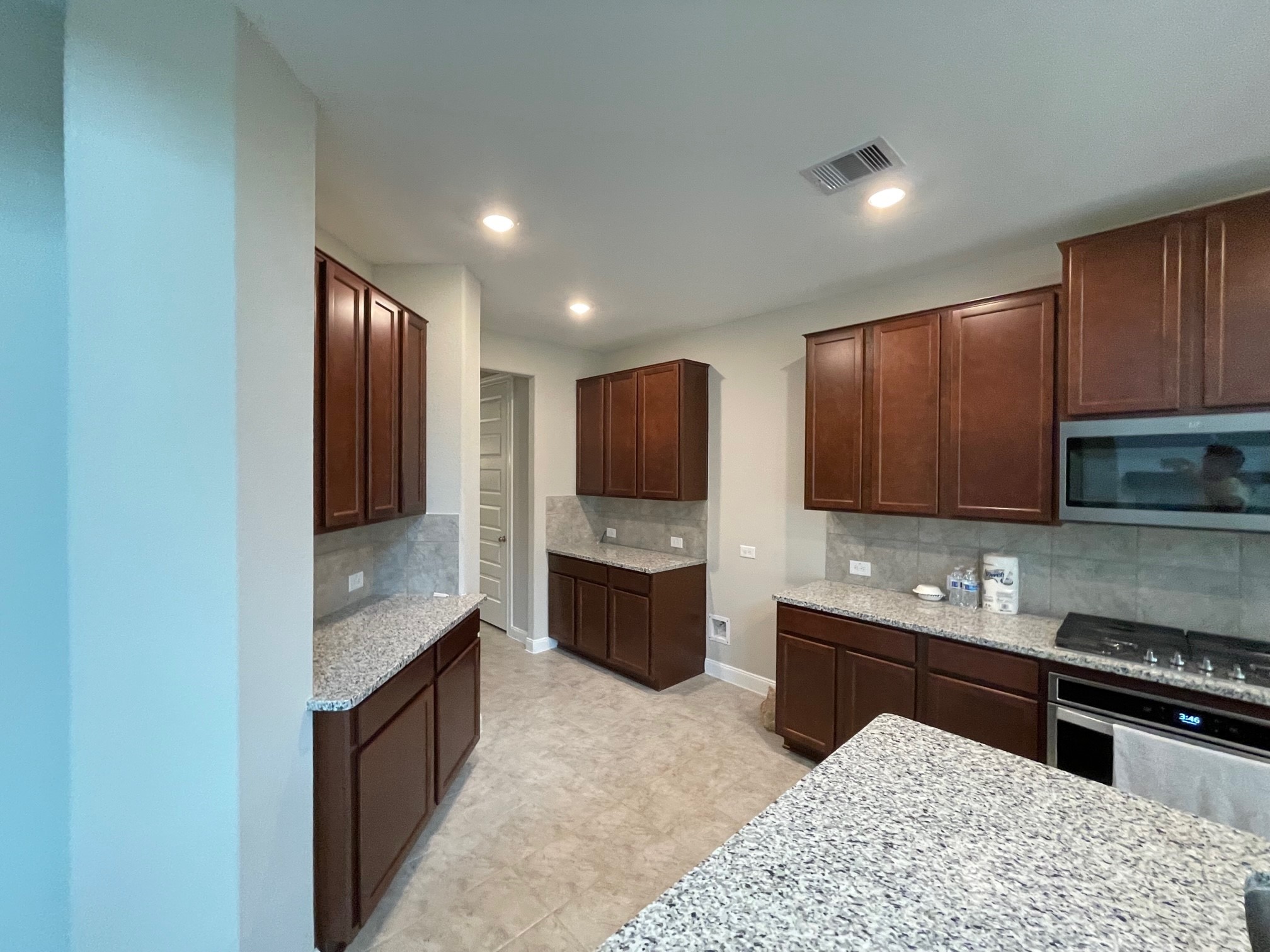 2216 Gadwall Court Conroe, TX 77384 - Photo 7 of 23 a kitchen with stainless steel appliances granite countertop a stove sink and cabinets