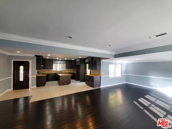 a lobby with furniture and stairs