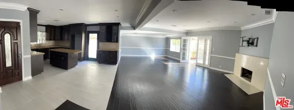 a view of a refrigerator in kitchen and dining room