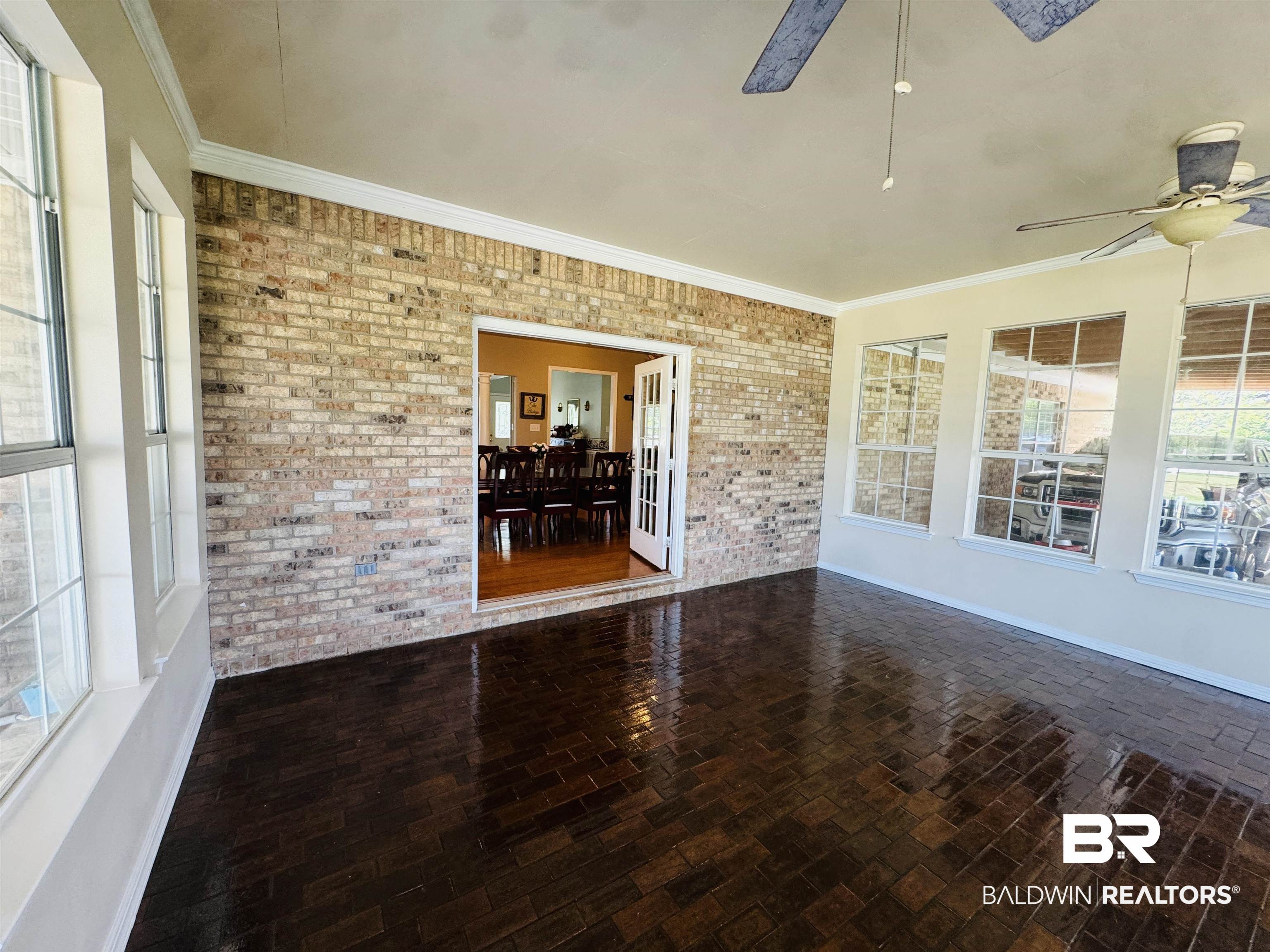 13795 White Road Silverhill, AL 36576 - Photo 40 of 99 Unfurnished sunroom with a ceiling fan and a patio area