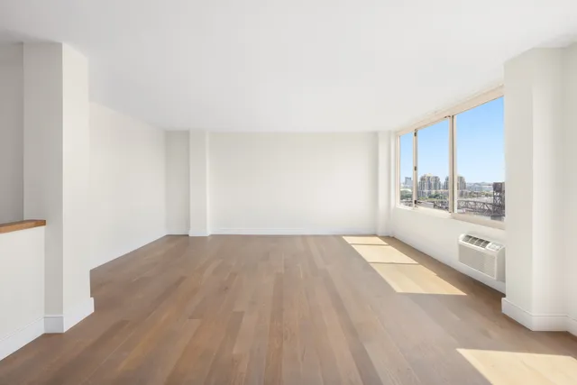 a view of an empty room with a window