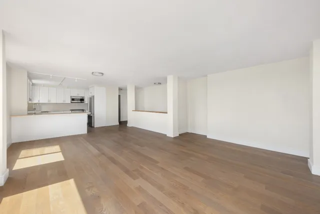 a view of a kitchen with a sink cabinets and a refrigerator