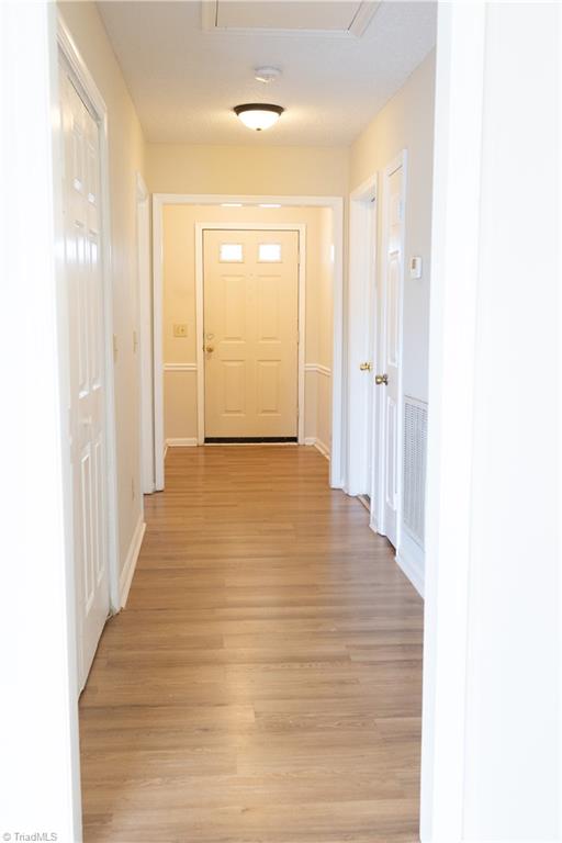 814 Guilford College Road, Unit 133 Greensboro, NC 27409 - Photo 18 of 29 Main Hallway to front door from living room view
