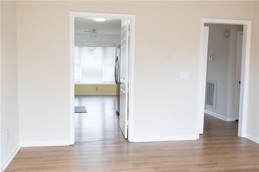 814 Guilford College Road, Unit 133 Greensboro, NC 27409 - Photo 5 of 29 Entry off the living room to kitchen and bedrooms