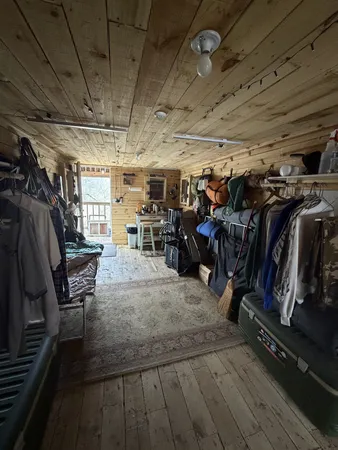 a view of dirt yard with a large tree