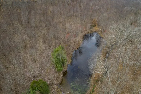 a view of a lake with houses in the back