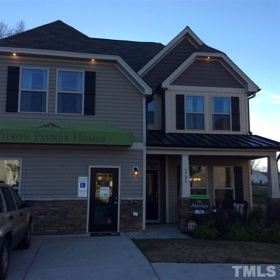 3706 Burtons Barn Street, Unit 2 Raleigh, NC 27610 - Photo 1 of 7 a front view of a house with barbeque