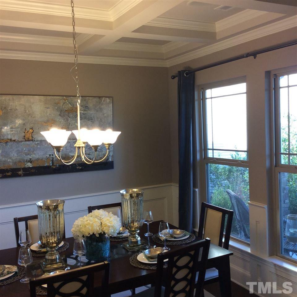 3706 Burtons Barn Street, Unit 2 Raleigh, NC 27610 - Photo 2 of 7 a view of a dining room with furniture window and outside view