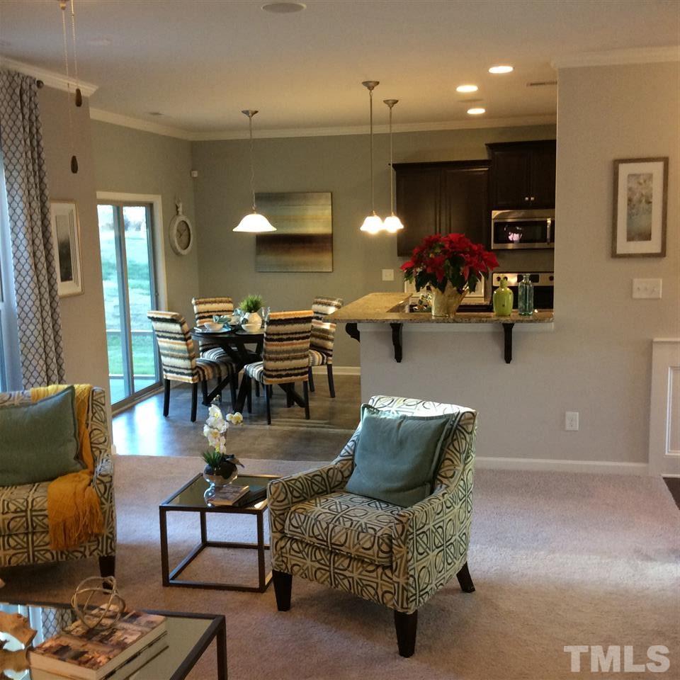 3706 Burtons Barn Street, Unit 2 Raleigh, NC 27610 - Photo 7 of 7 a living room with furniture and wooden floor