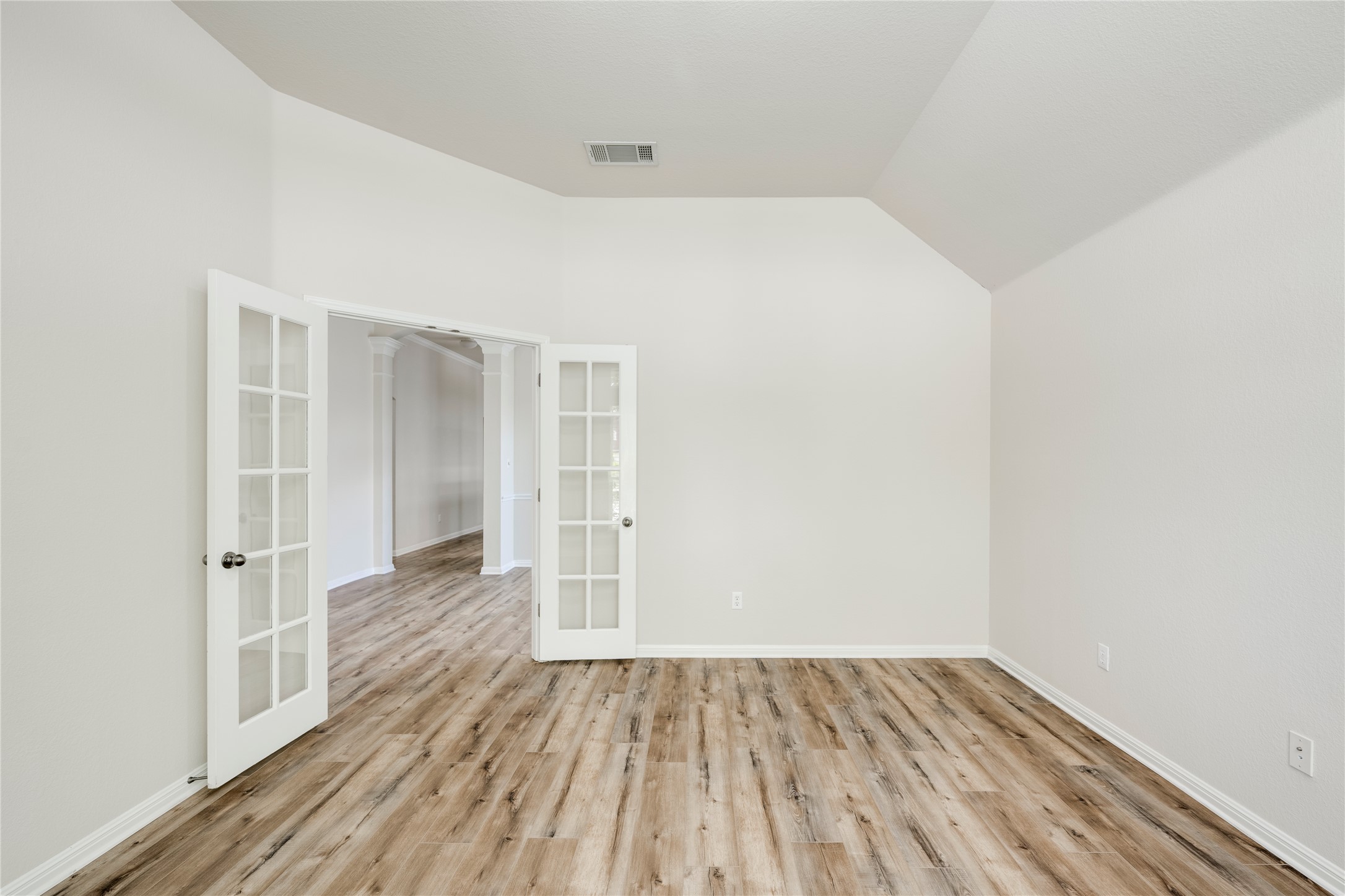 1813 Nelson Ranch Loop Cedar Park, TX 78613 - Photo 6 of 39 French doors open into this versatile space featuring rich hardwood flooring and a vaulted ceiling.