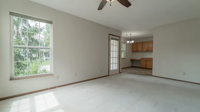 a view of a livingroom with furniture and window
