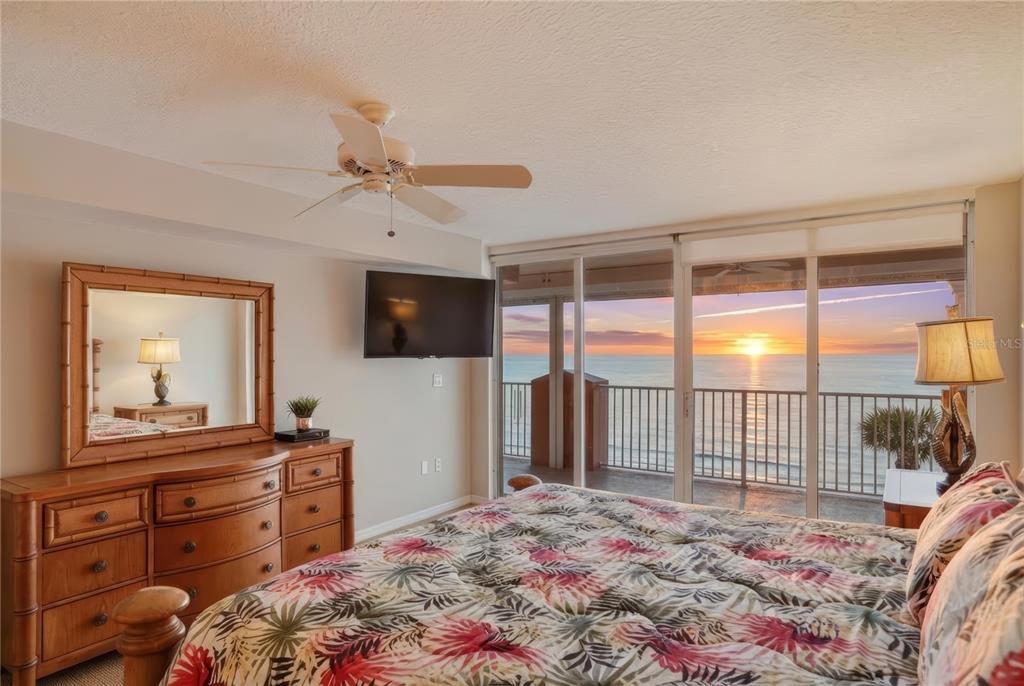 16326 Gulf Boulevard, Unit 307 Redington Beach, FL 33708 - Photo 14 of 43 a bedroom with a bed and a dresser in it