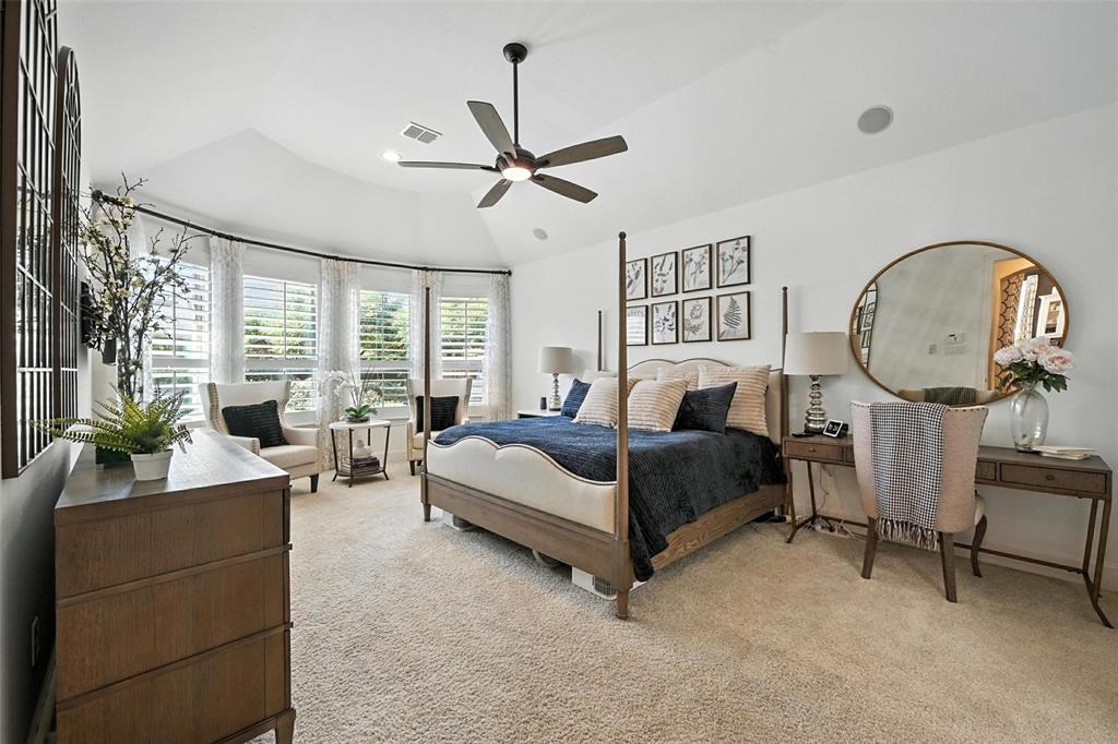 1909 Snapdragon Road Frisco, TX 75033 - Photo 17 of 40 a bedroom with a bed a mirror and a large window