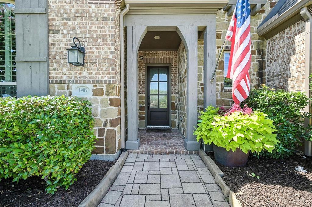 1909 Snapdragon Road Frisco, TX 75033 - Photo 2 of 40 a entryway with flower pots