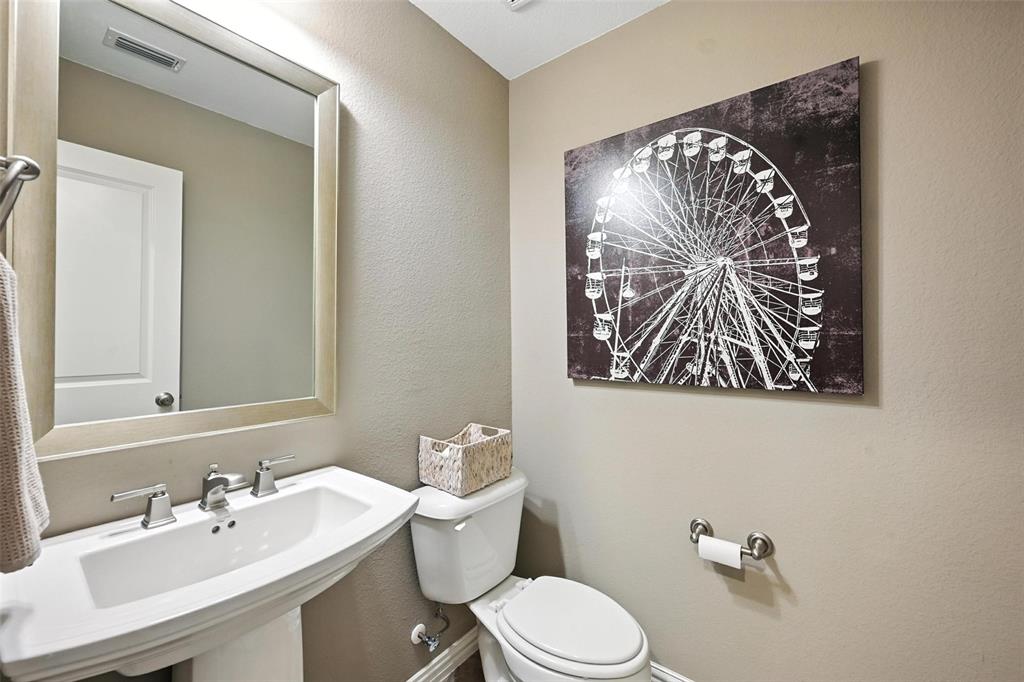 1909 Snapdragon Road Frisco, TX 75033 - Photo 27 of 40 a bathroom with a sink mirror and toilet