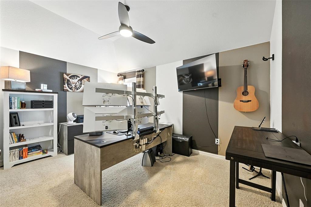 1909 Snapdragon Road Frisco, TX 75033 - Photo 28 of 40 a room with furniture and flat screen tv