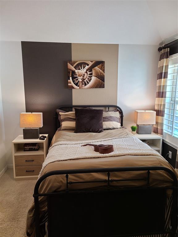 1909 Snapdragon Road Frisco, TX 75033 - Photo 29 of 40 a bedroom with a bed and a lamp on dresser