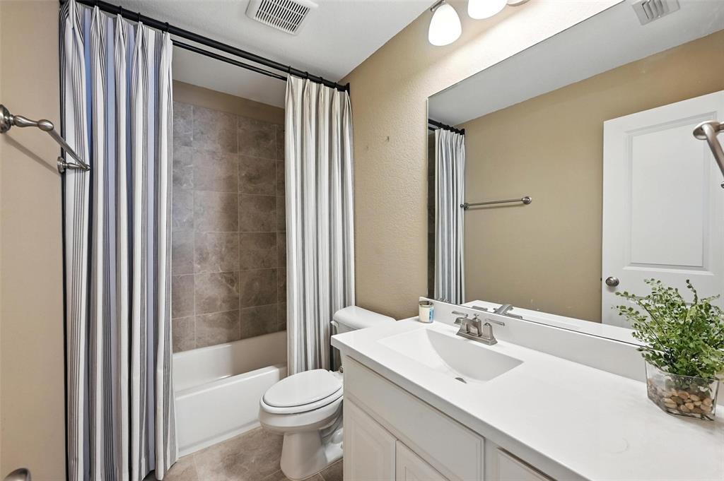 1909 Snapdragon Road Frisco, TX 75033 - Photo 30 of 40 a bathroom with a sink toilet and shower