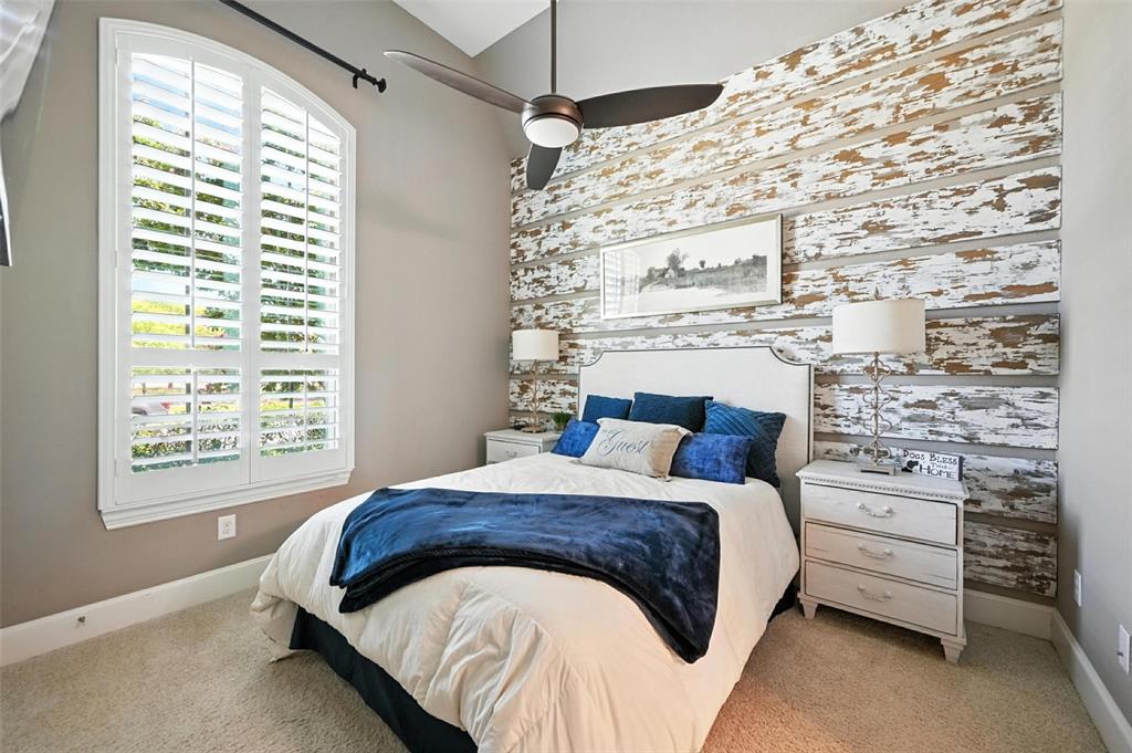 1909 Snapdragon Road Frisco, TX 75033 - Photo 34 of 40 a bed sitting in a bedroom next to a window