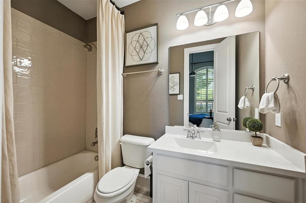 1909 Snapdragon Road Frisco, TX 75033 - Photo 35 of 40 a bathroom with a sink toilet and shower