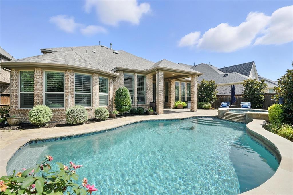 1909 Snapdragon Road Frisco, TX 75033 - Photo 39 of 40 front view of a house with a garden