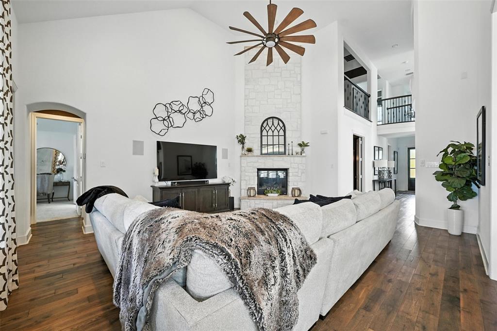 1909 Snapdragon Road Frisco, TX 75033 - Photo 7 of 40 a living room with fireplace furniture and a flat screen tv