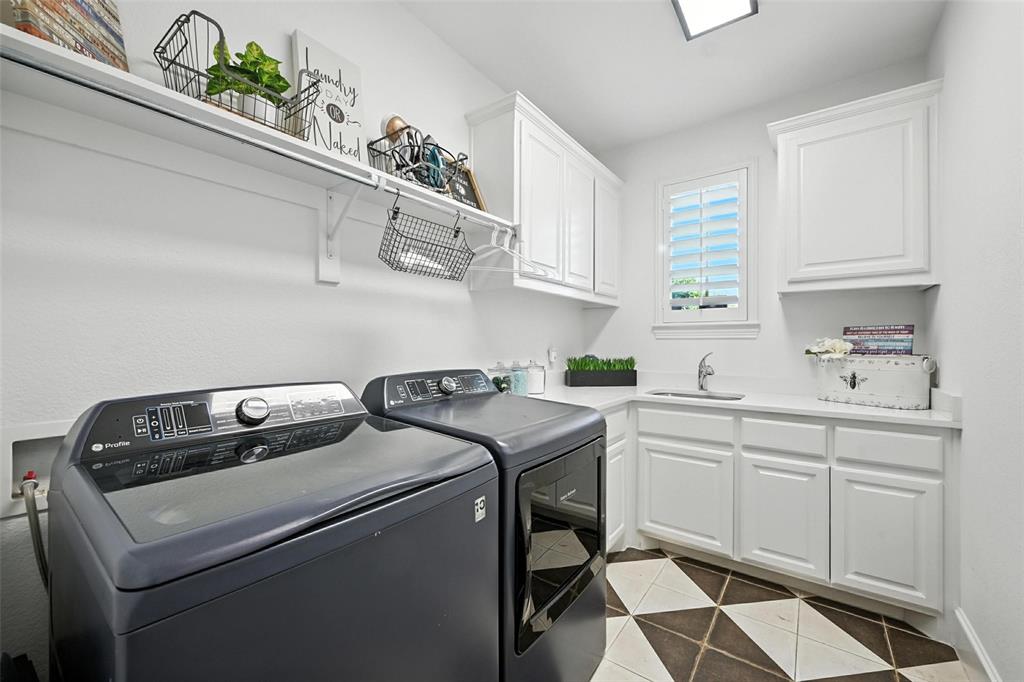 1909 Snapdragon Road Frisco, TX 75033 - Photo 9 of 40 a utility room with closet dryer and washer