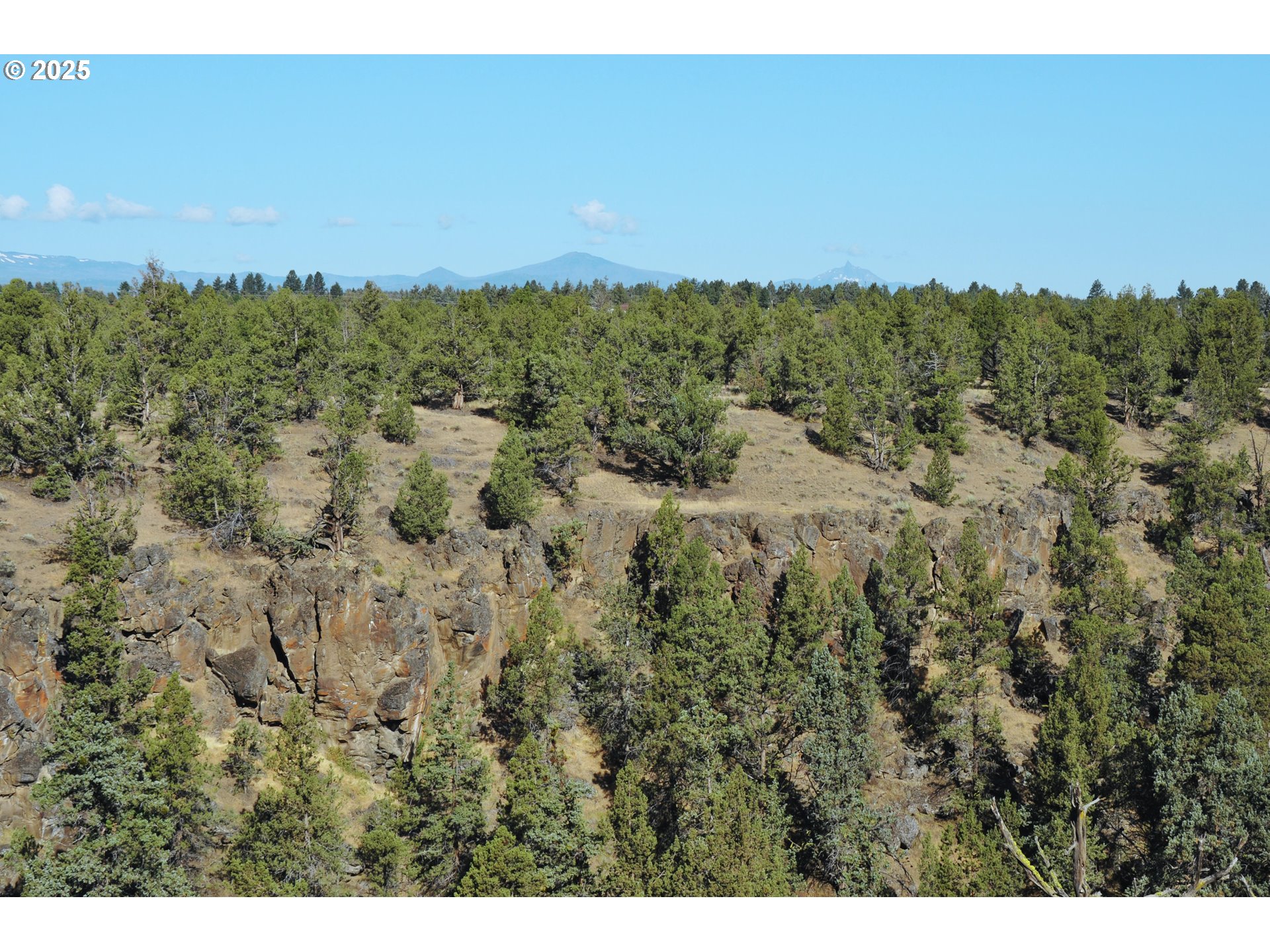65255 Swalley Road Bend, OR 97703 - Photo 16 of 48 a view of a city and mountains in the background