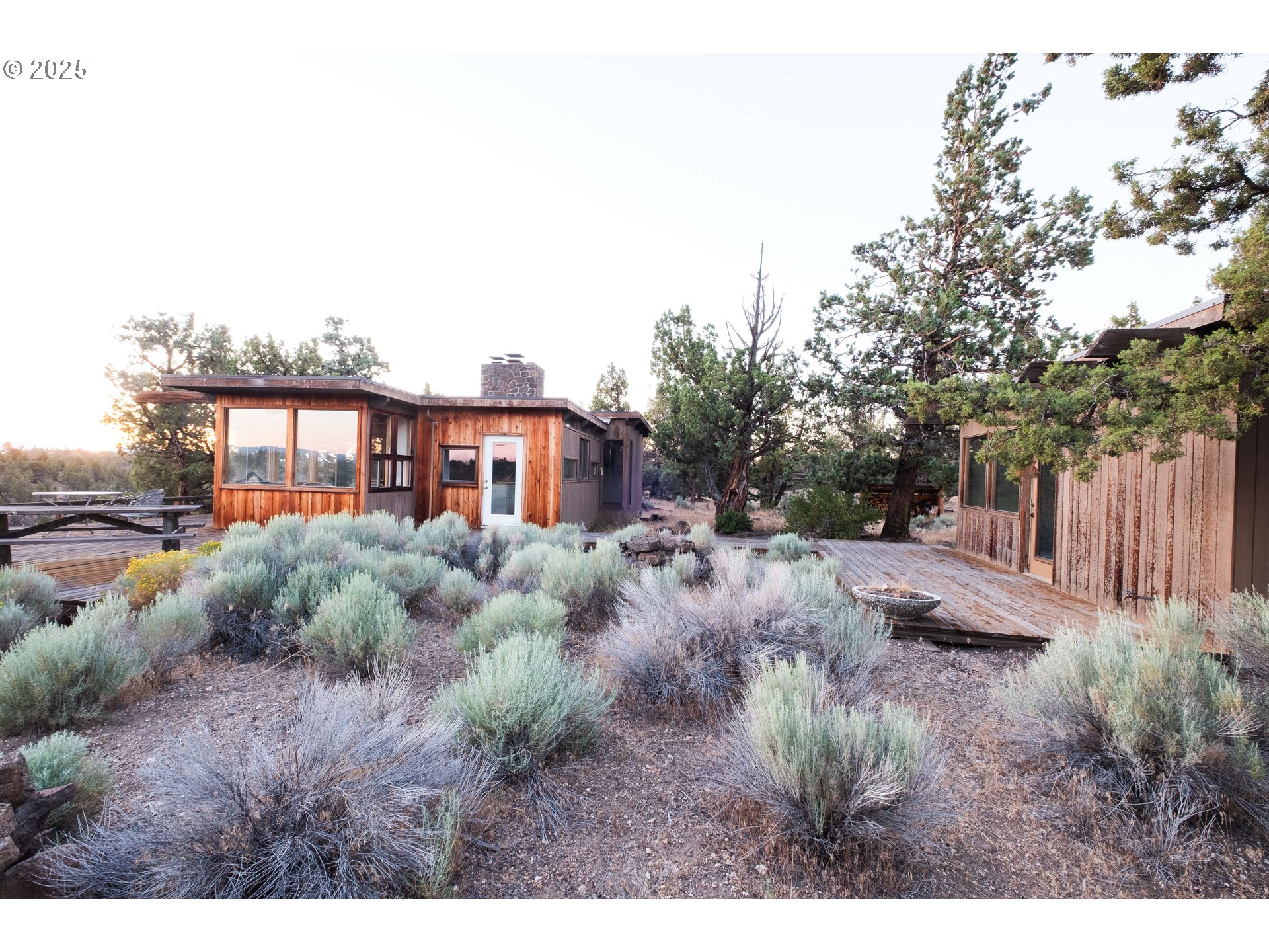 65255 Swalley Road Bend, OR 97703 - Photo 35 of 48 a view of a house with a backyard