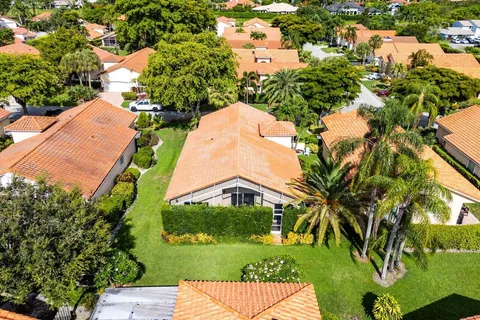 an aerial view of residential houses with outdoor space and street view