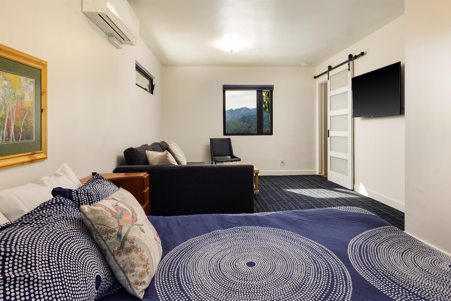 1417 Foothill Road Ojai, CA 93023 - Photo 32 of 41 a bedroom with a bed and a flat screen tv
