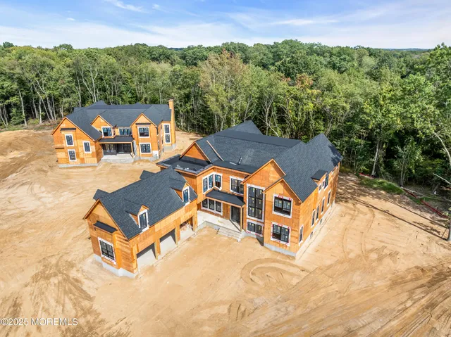 an aerial view of a house with pool