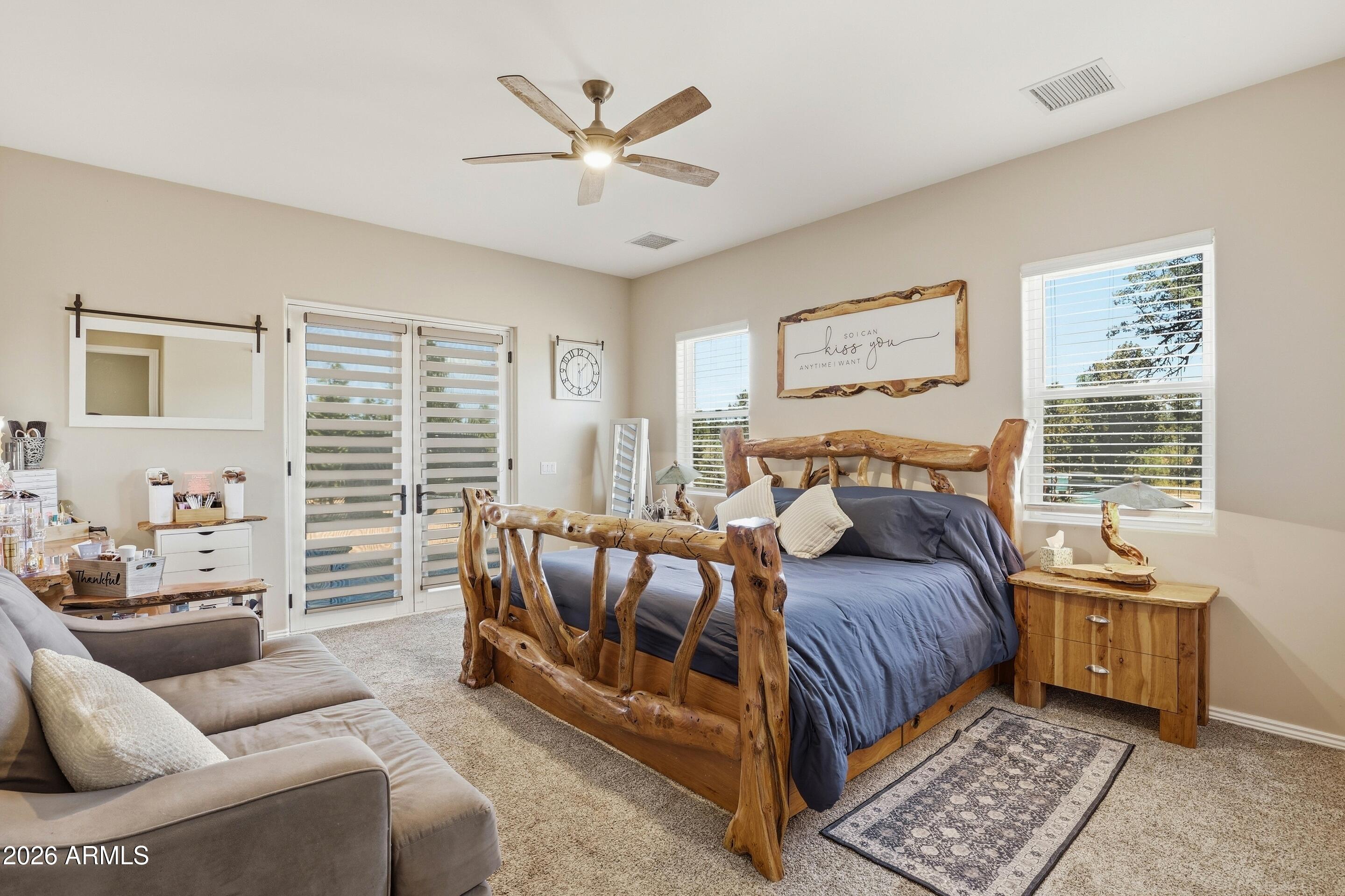 1206 East Bolivar Street Payson, AZ 85541 - Photo 12 of 43 a bedroom with a bed and a couch