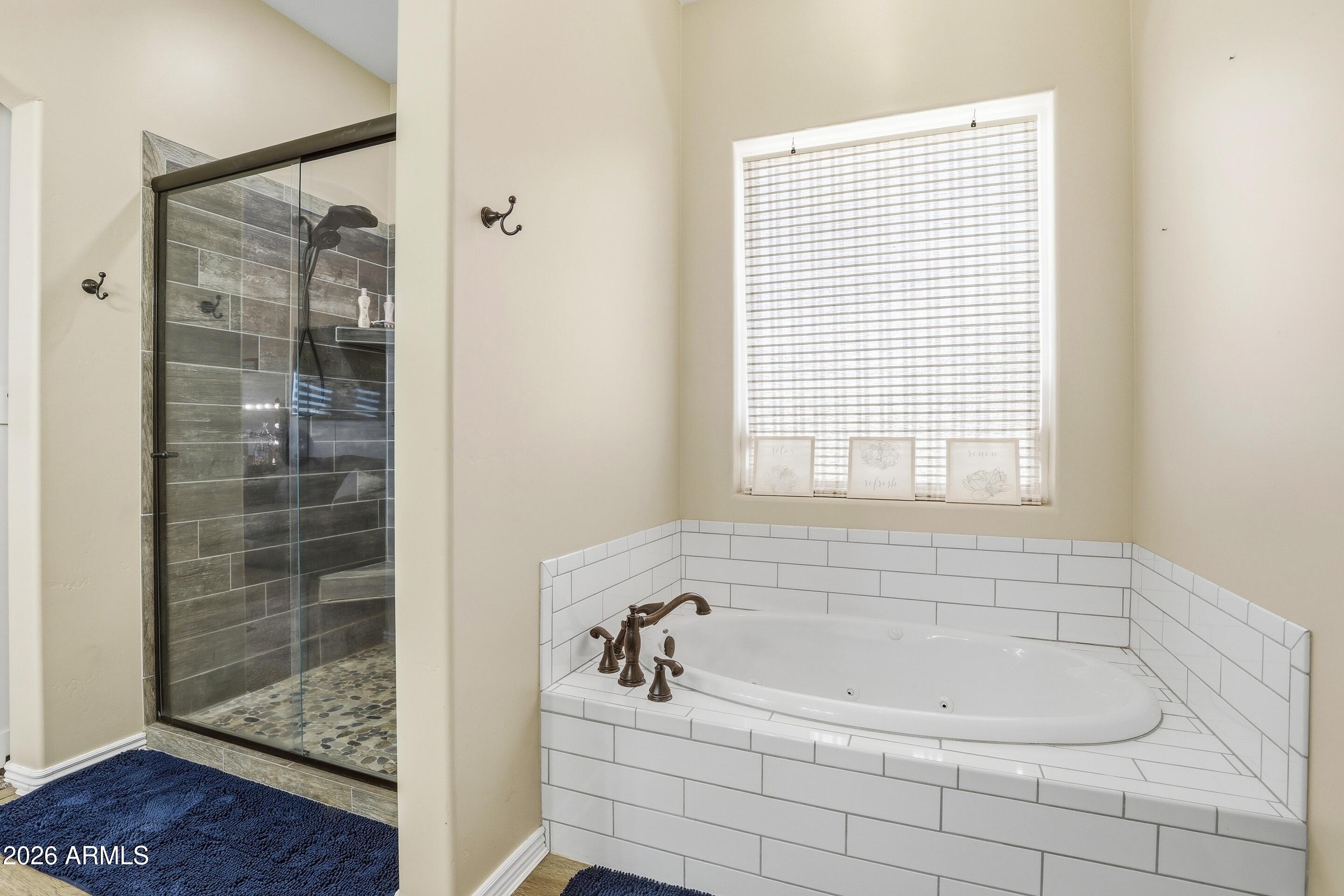 1206 East Bolivar Street Payson, AZ 85541 - Photo 15 of 43 a white bath tub sitting next to a shower
