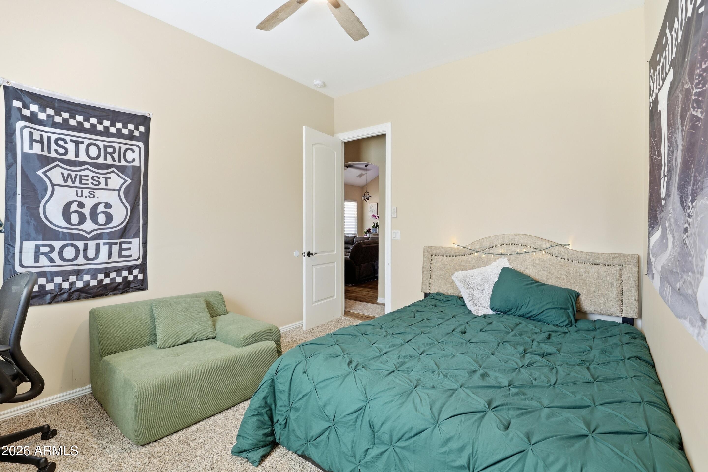 1206 East Bolivar Street Payson, AZ 85541 - Photo 18 of 43 a bedroom with a bed and a couch