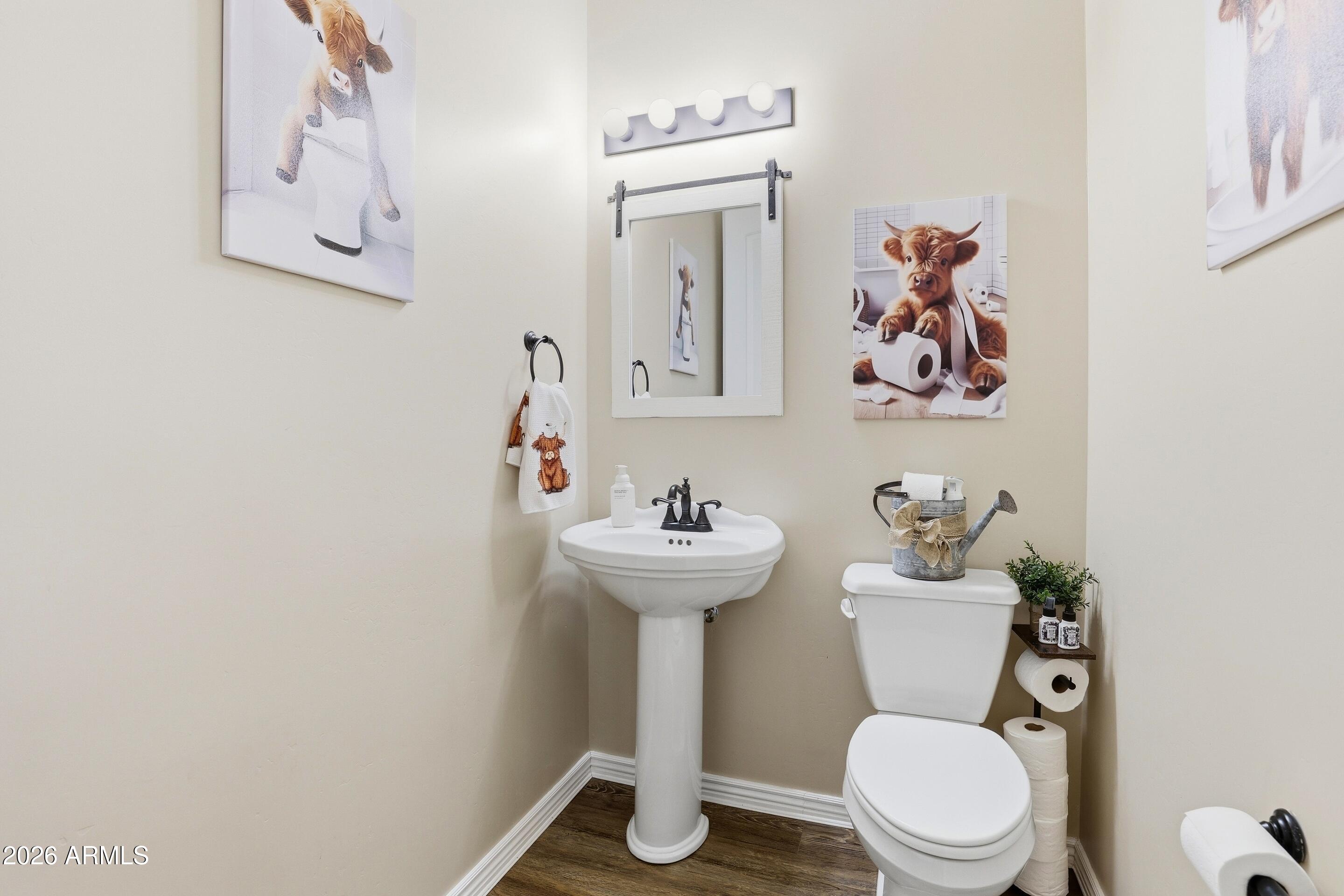 1206 East Bolivar Street Payson, AZ 85541 - Photo 21 of 43 a bathroom with a toilet sink and mirror
