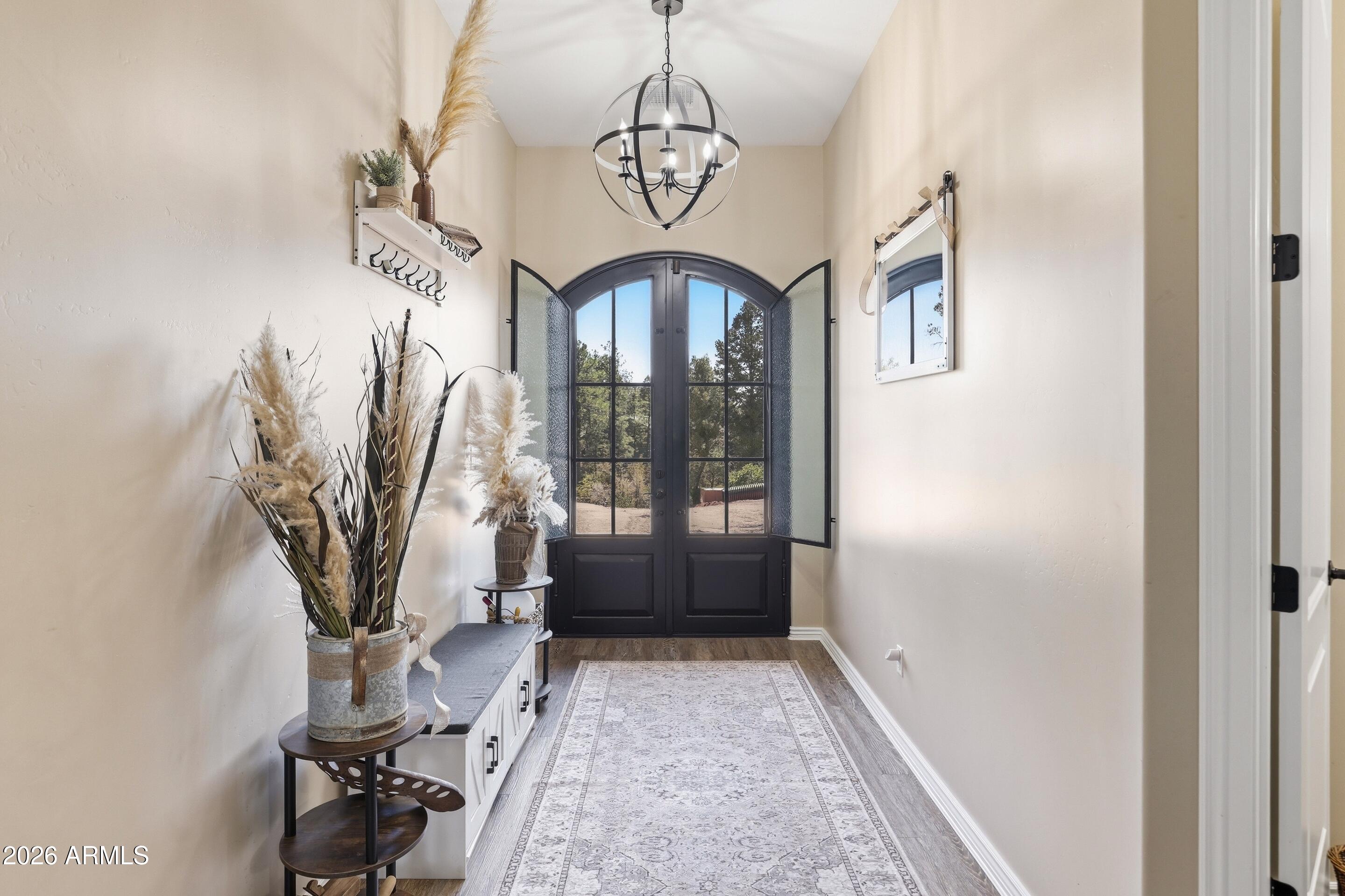 1206 East Bolivar Street Payson, AZ 85541 - Photo 23 of 43 a view of entryway with a front door and wooden floor