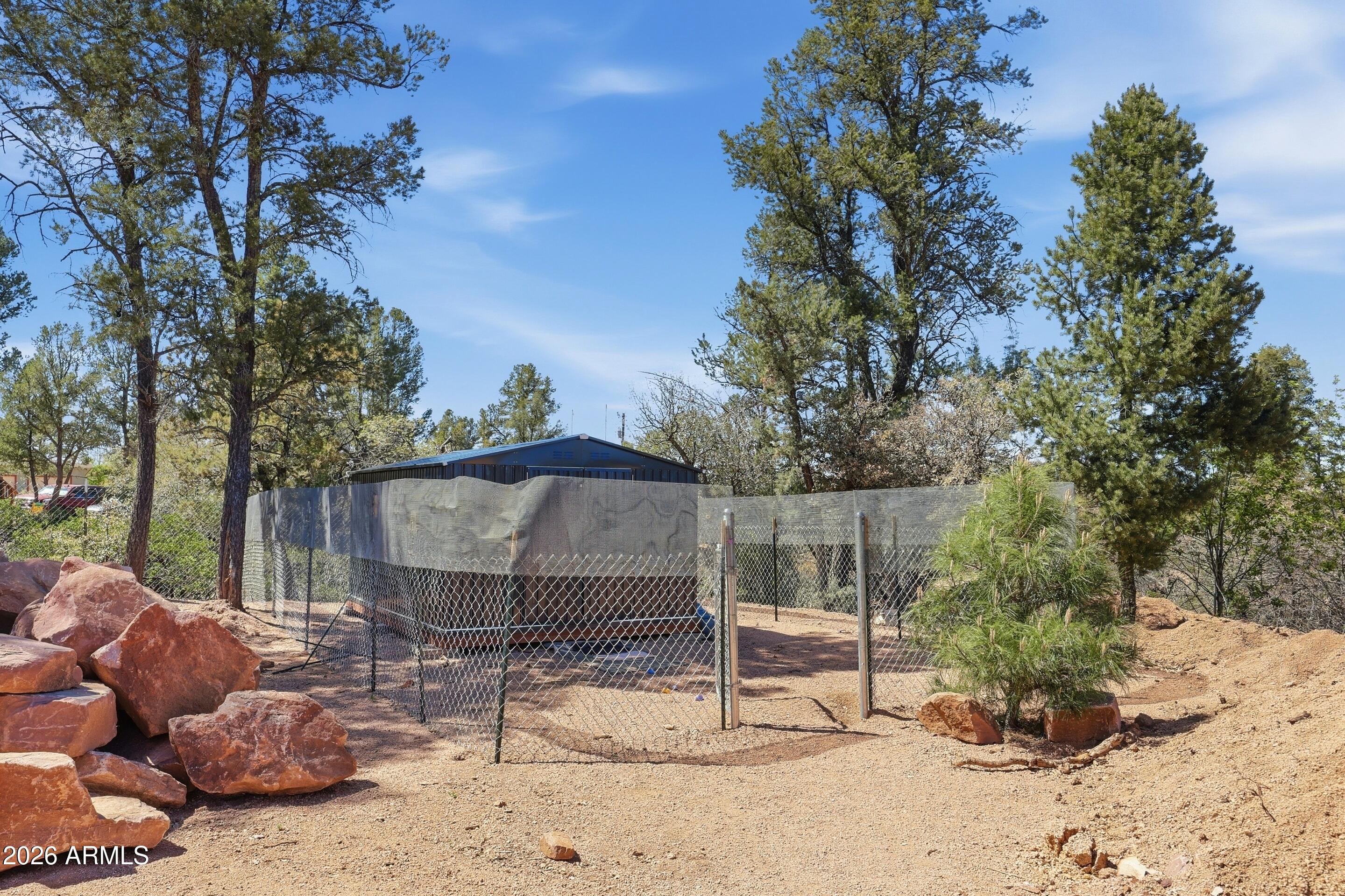 1206 East Bolivar Street Payson, AZ 85541 - Photo 26 of 43 a view of a backyard with a tree