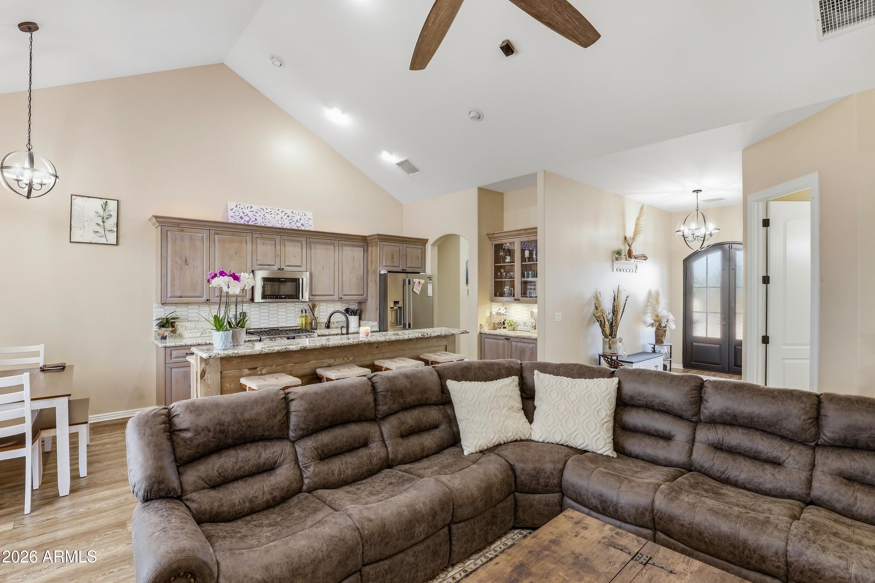 1206 East Bolivar Street Payson, AZ 85541 - Photo 3 of 43 a living room with furniture kitchen view and a wooden floor