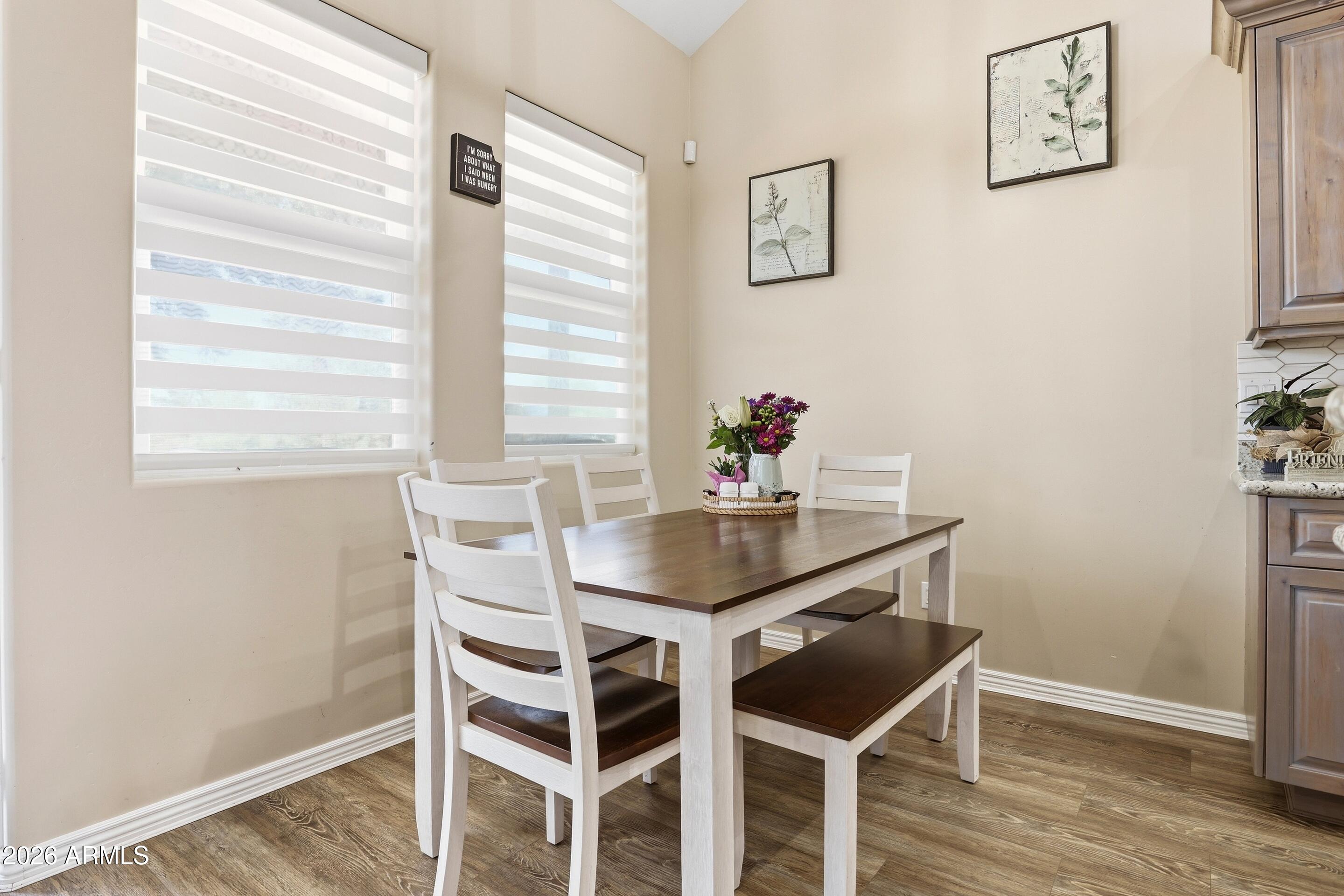 1206 East Bolivar Street Payson, AZ 85541 - Photo 9 of 43 a view of a dining room with furniture and wooden floor